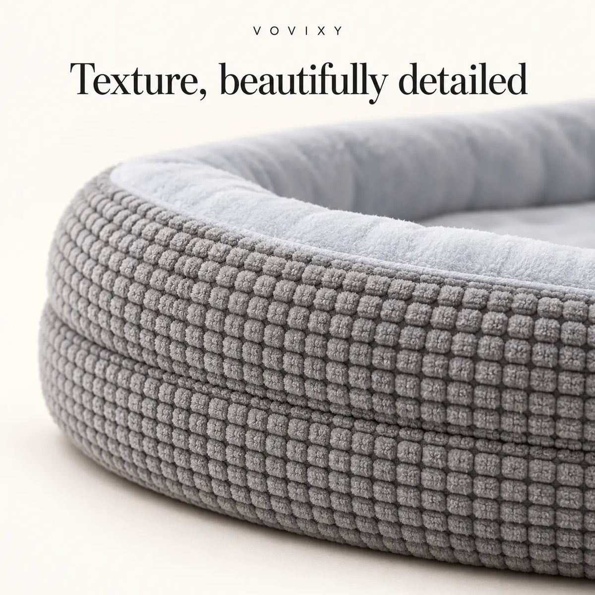 Close-up of the waffle texture and padded edge on the Light Gray dog bed