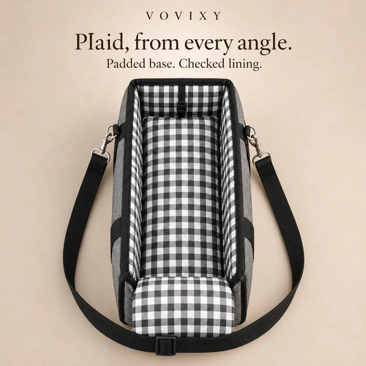 Open-top pet car seat showing its plaid padded base, checked lining and adjustable shoulder strap