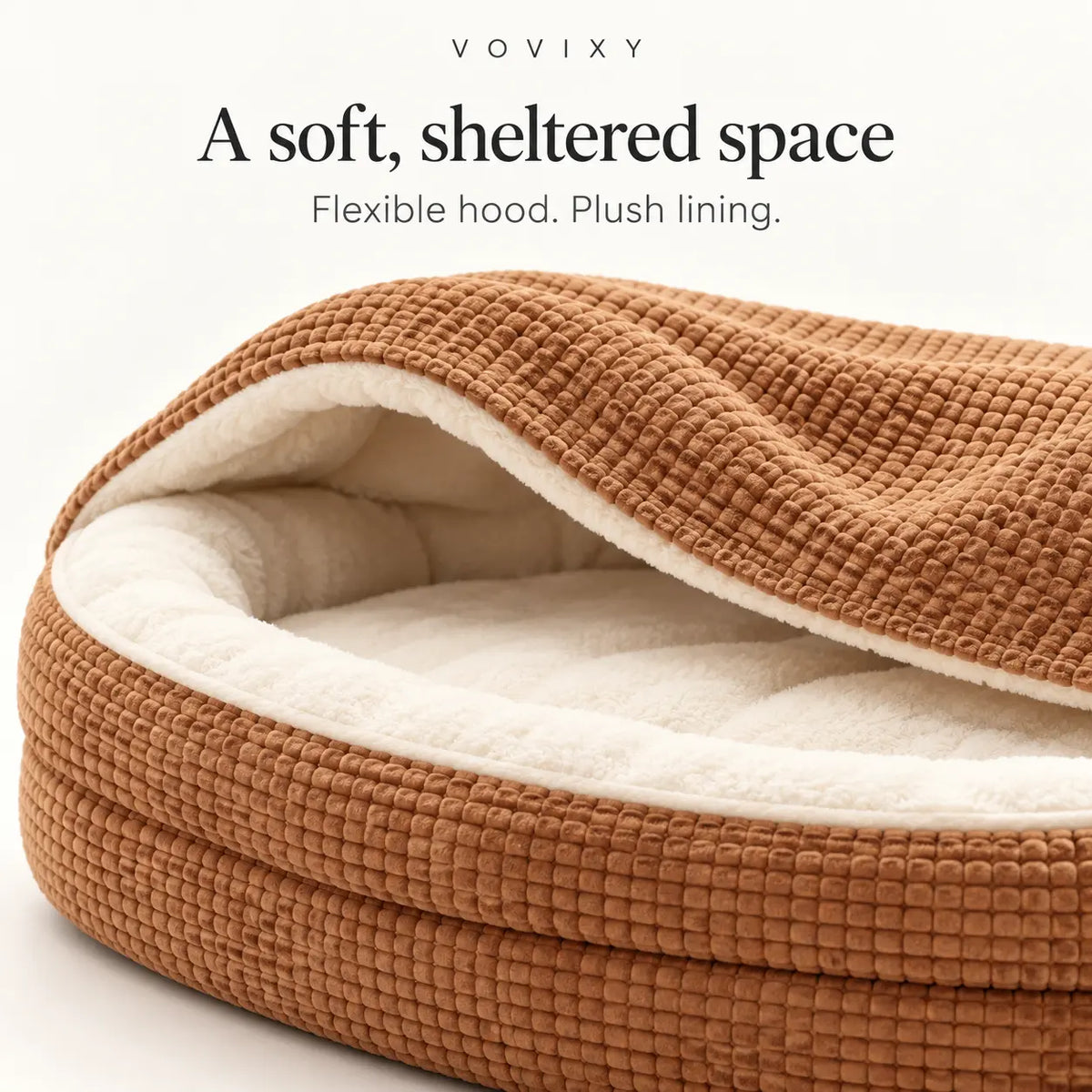 Khaki hooded dog bed showing the flexible waffle cover, cream plush lining and padded rim