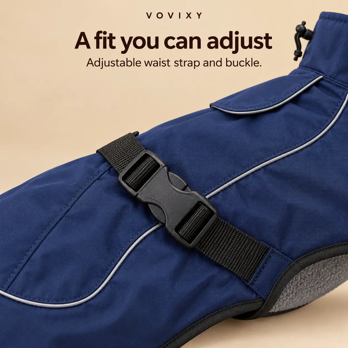 Close-up of the adjustable waist strap and black buckle on the Navy Blue dog windbreaker