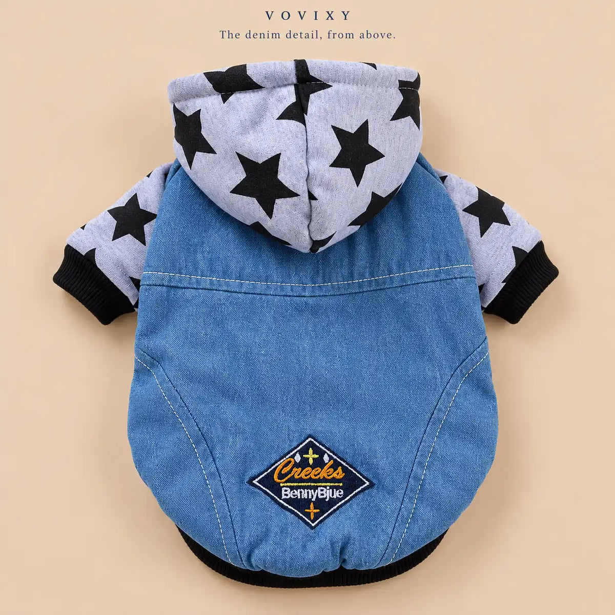 Flat lay of the Grey star-print denim dog hoodie showing the hood, short sleeves and embroidered back patch