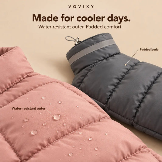 Close-up of pink and grey padded dog coats showing the water-resistant outer and stitched baffles