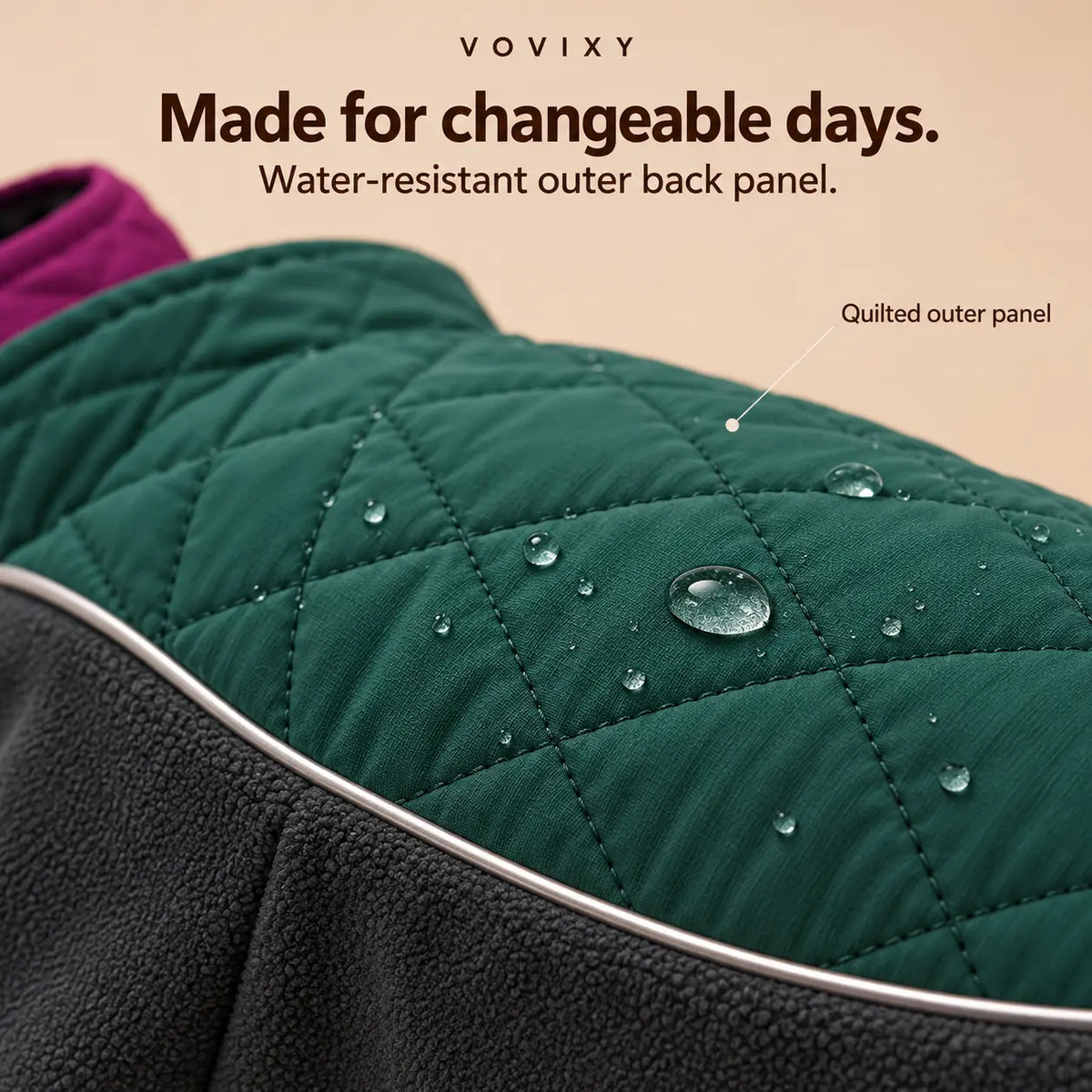 Water droplets on the Deep Teal quilted outer back panel of a winter dog coat