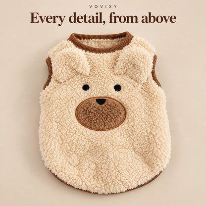 Flat lay of the Apricot teddy fleece dog vest with bear ears, a stitched face and a round neckline
