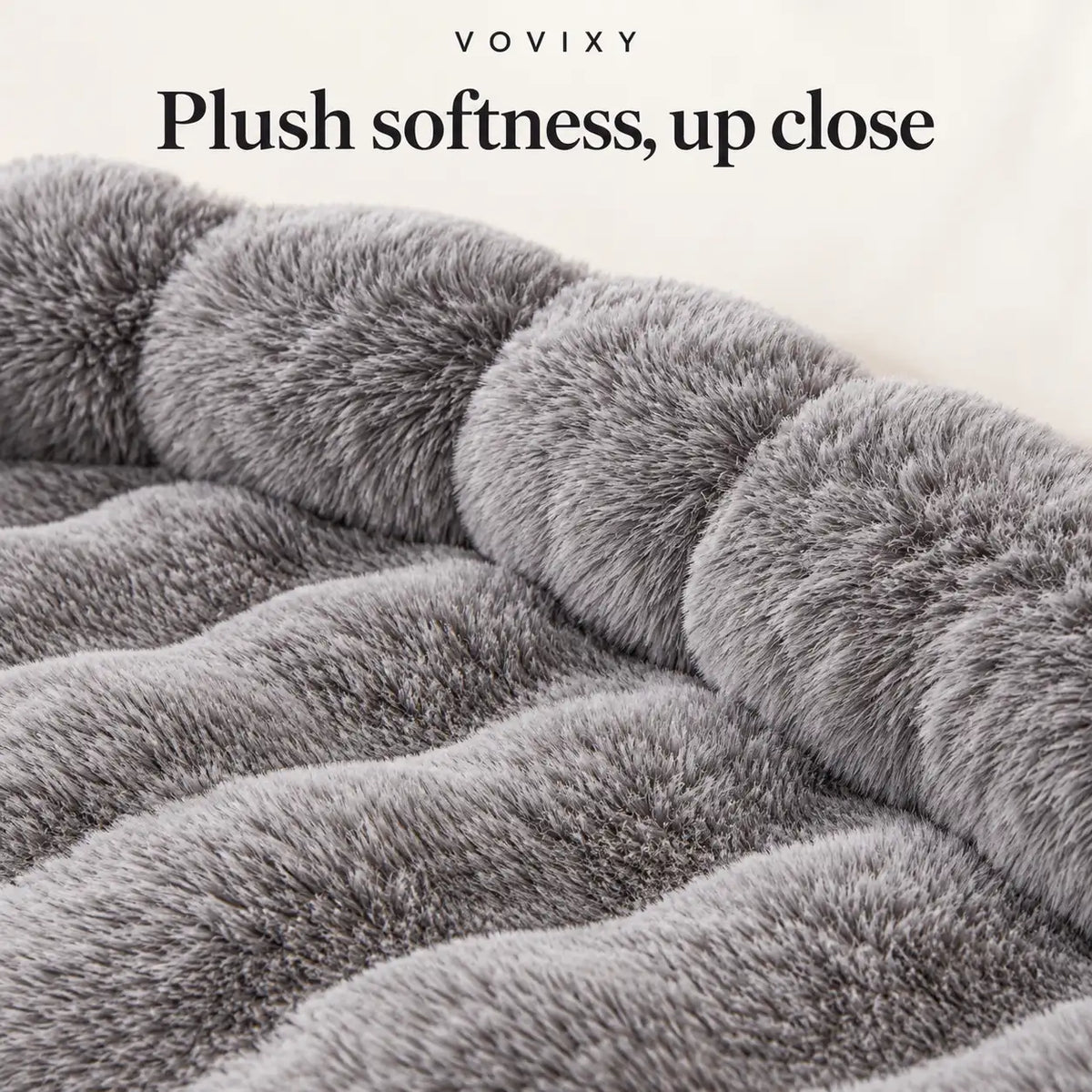 Close-up of the Dark Gray mat's soft plush texture, rippled resting surface and padded edge