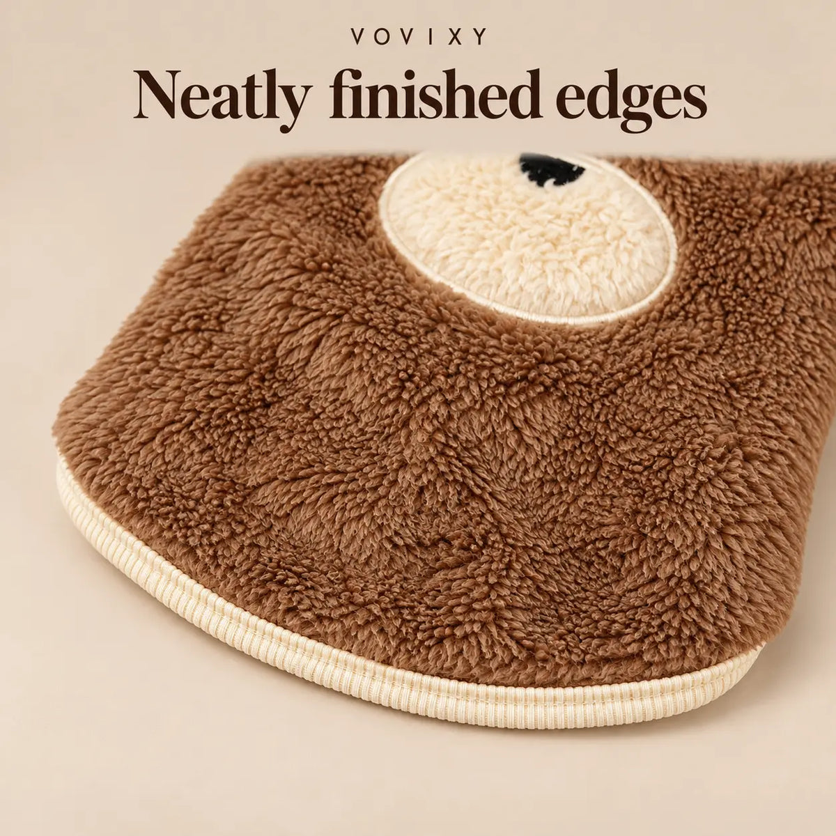 Brown teddy fleece dog vest showing its curved hem, cream trim and bear muzzle detail