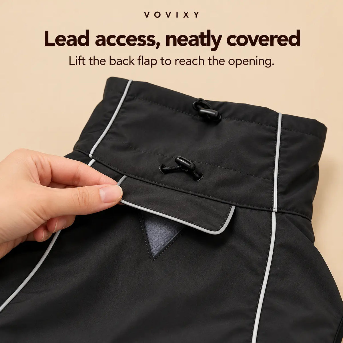Back flap lifted on the Black dog windbreaker to show the covered lead opening