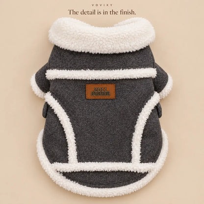 Rear detail of a Dark Grey dog coat with cream plush trim and a curved hem