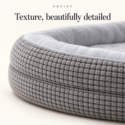 Close-up of the waffle texture and padded edge on the Light Gray dog bed