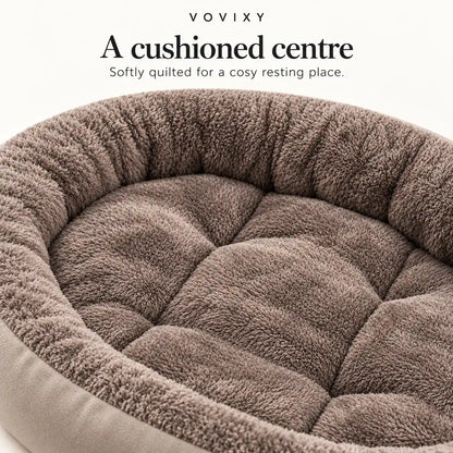 Grey plush bolster pet bed showing the quilted sleeping centre and raised padded sides