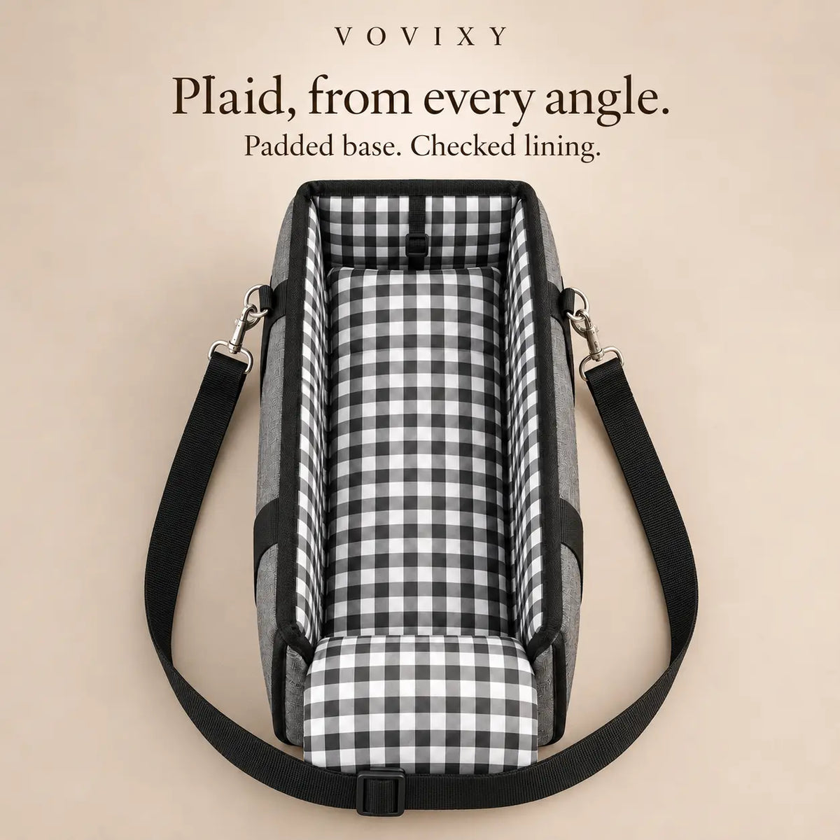 Open-top pet car seat showing its plaid padded base, checked lining and adjustable shoulder strap
