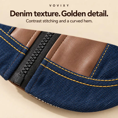 Close-up of the denim pet jacket's curved hem, back zip and golden contrast stitching