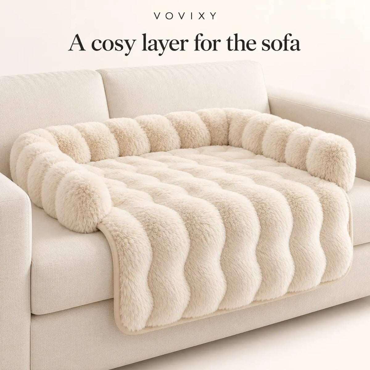 Beige plush dog sofa mat with raised back and side bolsters on a light sofa