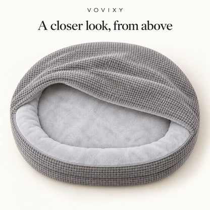 Overhead view of the Light Gray waffle hooded dog cave bed and plush sleeping area