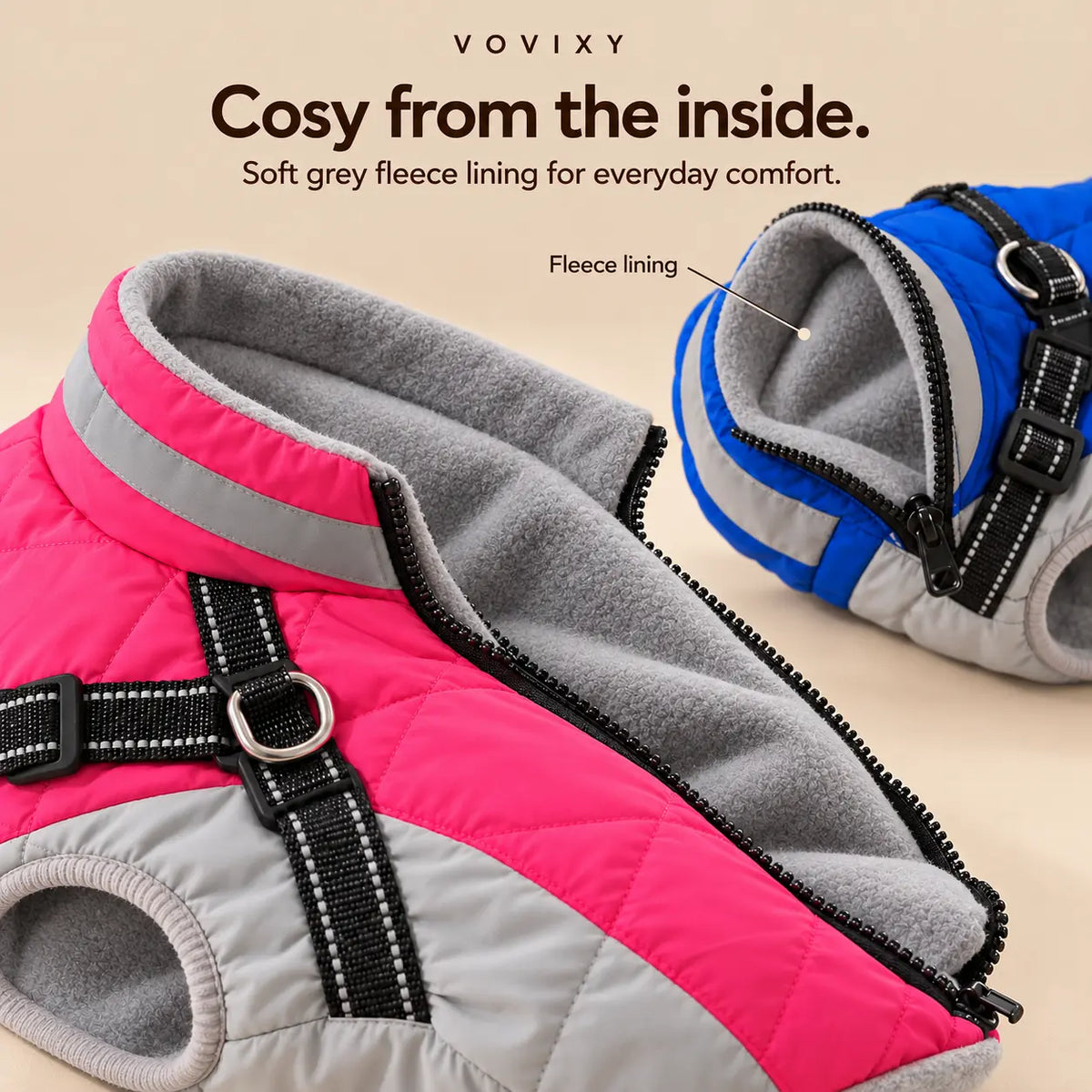 Close-up of pink and blue dog jackets showing the soft grey fleece lining
