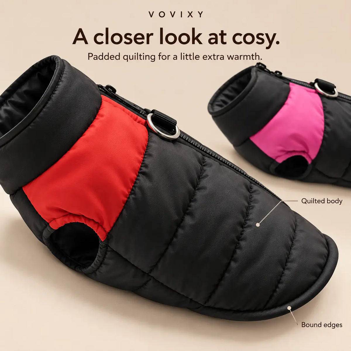 Close-up of red and pink dog vests showing the padded quilting, raised collar and bound edges