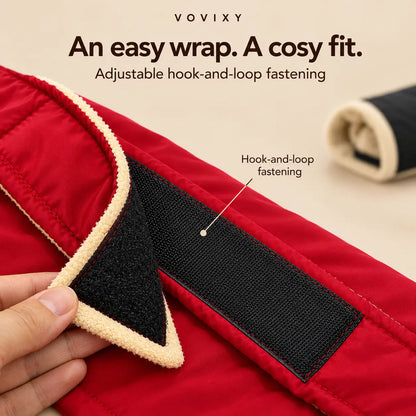 Close-up of a crimson red dog coat with adjustable hook-and-loop wrap fastening
