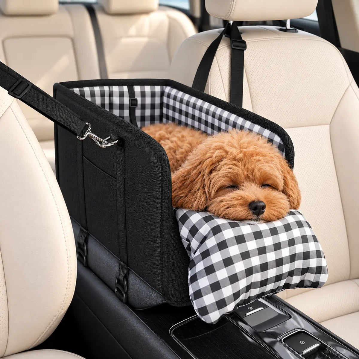 Small apricot dog resting inside the black console pet car seat with its plaid front cushion