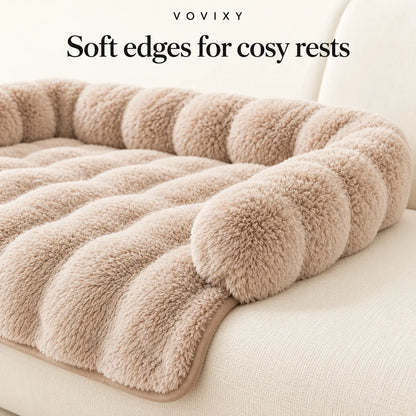 Close-up of the Coffee plush sofa mat showing its rounded bolster edge and draped front panel