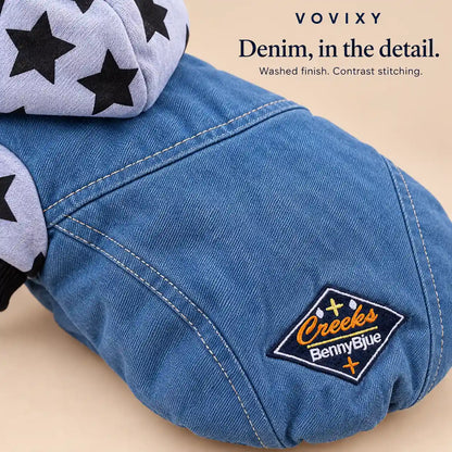 Close-up of contrast stitching and the embroidered back patch on the washed-blue denim dog hoodie
