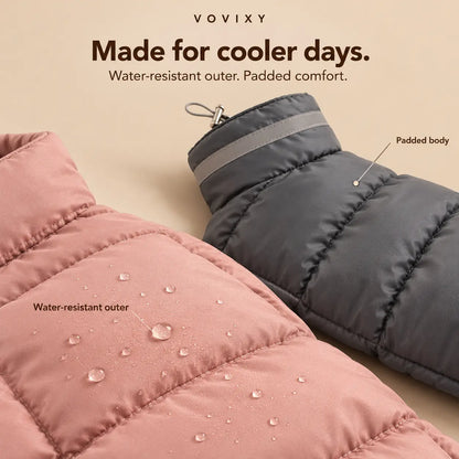 Close-up of pink and grey padded dog coats showing the water-resistant outer and stitched baffles