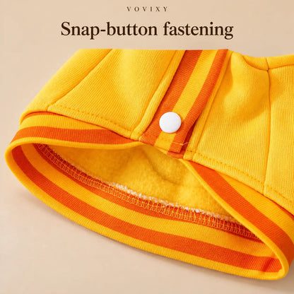 Close-up of a front snap button and orange striped hem on the Yellow Bear dog sweatshirt
