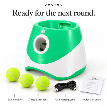 Green automatic dog ball launcher with three mini tennis balls, USB charging cable and user guide